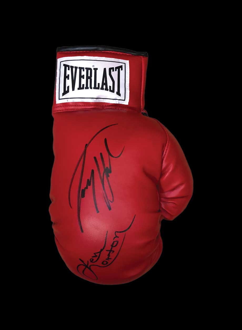 Larry Holmes & Ken Norton dual signed boxing glove - Unframed + PS0.00