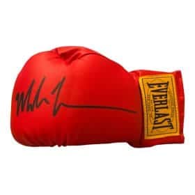 Red boxing glove with a black autograph and an Everlast patch on the wrist area.
