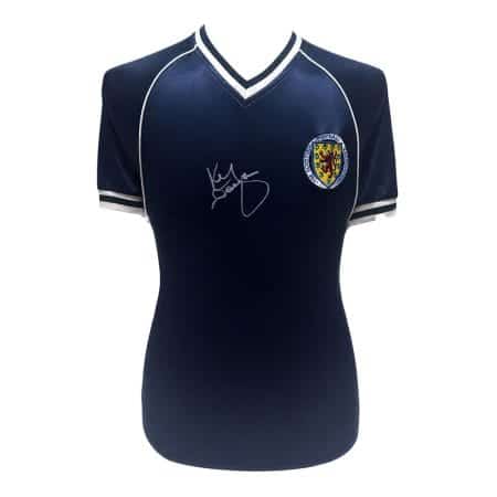 Autographed navy blue football jersey with white trim and a crest on the left chest, displayed on a mannequin