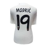 White Real Madrid football jersey shown from the back with the name MODRIĆ and the number 19.