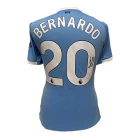 Blue soccer jersey back view with the name 'BERNARDO' and large number 20, plus a signature on the 2.