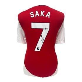 Red Arsenal football jersey back with the name SAKA and number 7, including a signature.