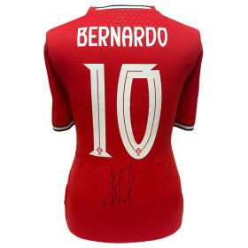 Red sports jersey back with the name 'BERNARDO' and a large number 10, plus a signature near the lower back area.